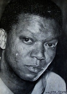 William Gardner Smith, a Black man, wears a white shirt and looks into the camera.