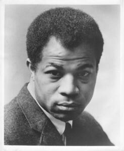 <p>Raised in Jersey City, New Jersey, Lonne Elder III (1927-1996) commuted across the Hudson River to New York City to find his feet as an actor, playwright, and screenwriter. He played the character of Bobo in the Broadway premiere of Lorraine Hansberry’s <em>A Raisin in the Sun</em> (1959), one of the FBI’s favorite dramas. Elder’s first play of his own, <em>Ceremonies in Dark Old Men </em>(1969), was produced by the Negro Ensemble Company and won him a Drama Desk Award for the year’s Most Promising Playwright. Still his best-regarded work, <em>Ceremonies</em> studied the self-sustaining rituals shared by two elderly black men in a struggling Harlem barbershop. Elder’s screenplay for <em>Sounder </em>(1972), a hit film starring Cicely Tyson and Paul Winfield, received an Academy Award nomination and was widely praised as a nuanced and responsible alternative to the then-thriving genre of “Blaxploitation” movies. Taking a turn to humor, he co-wrote the Richard Pryor vehicle <em>Bustin’ Loose</em> (1981). Elder briefly came under FBI suspicion in the nervous Cold War atmosphere of 1954.</p>